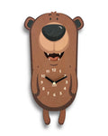 Cute bear-shaped wooden wall clock with playful face and visible clock hands.