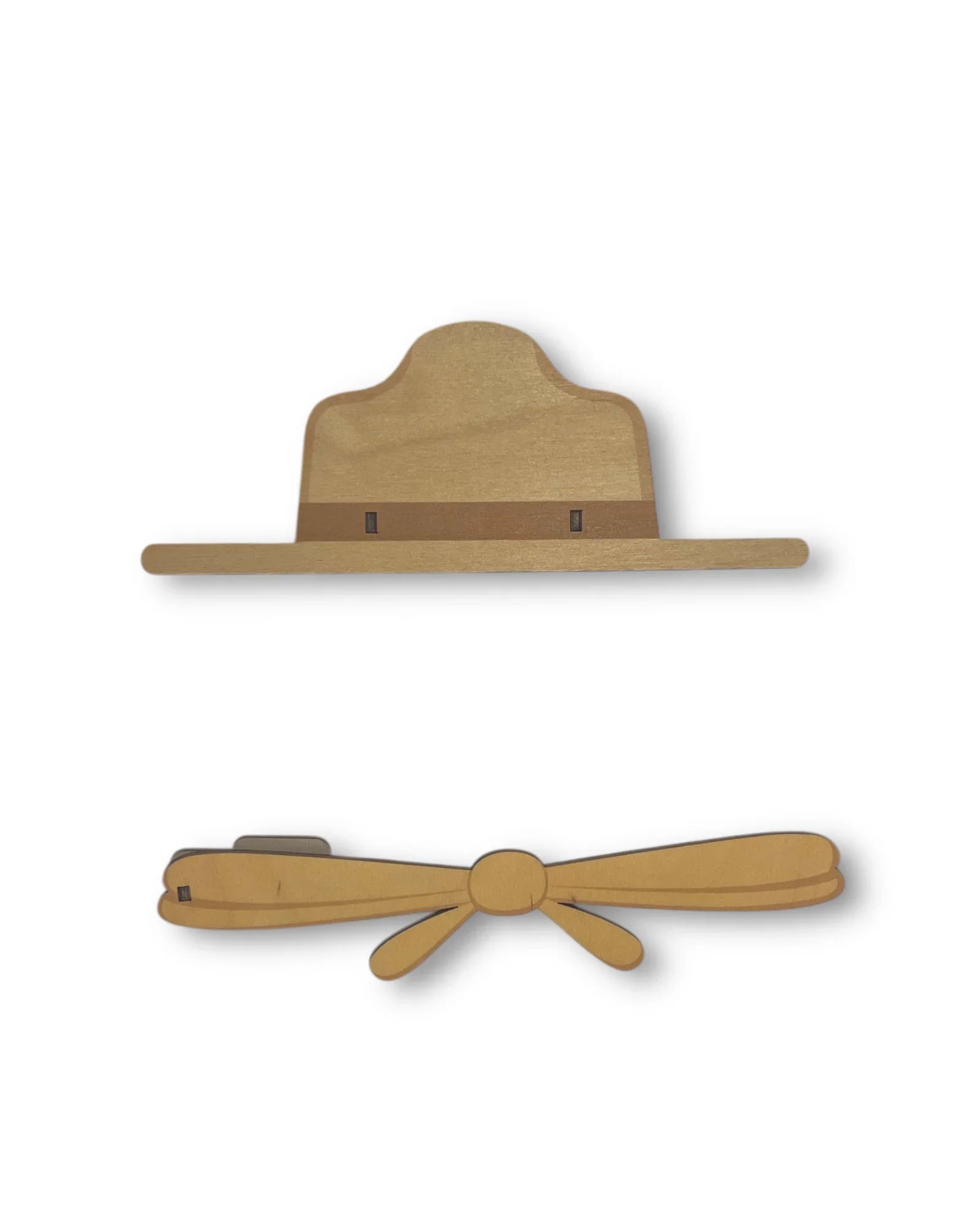 Wooden ranger hat and bow tie wall decor on white background