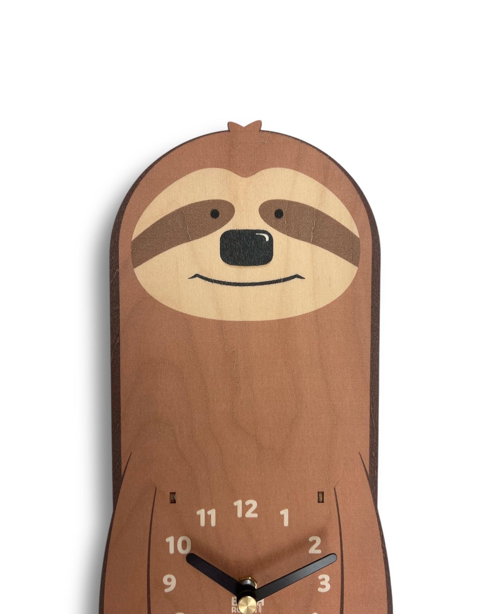 Handcrafted wooden clock shaped like a sloth with minimalist numbers and black hands